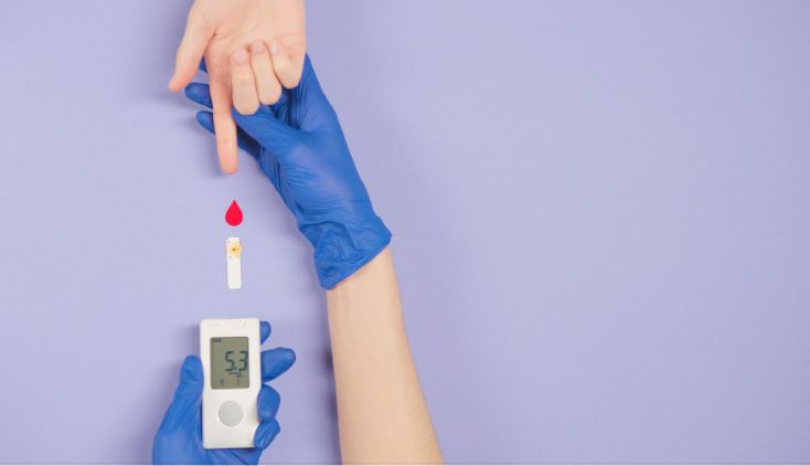 Two sets of hands on a purple background, taking a blood glucose test for diabetes.