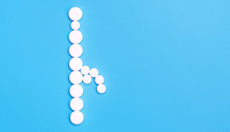 White pills on a blue background